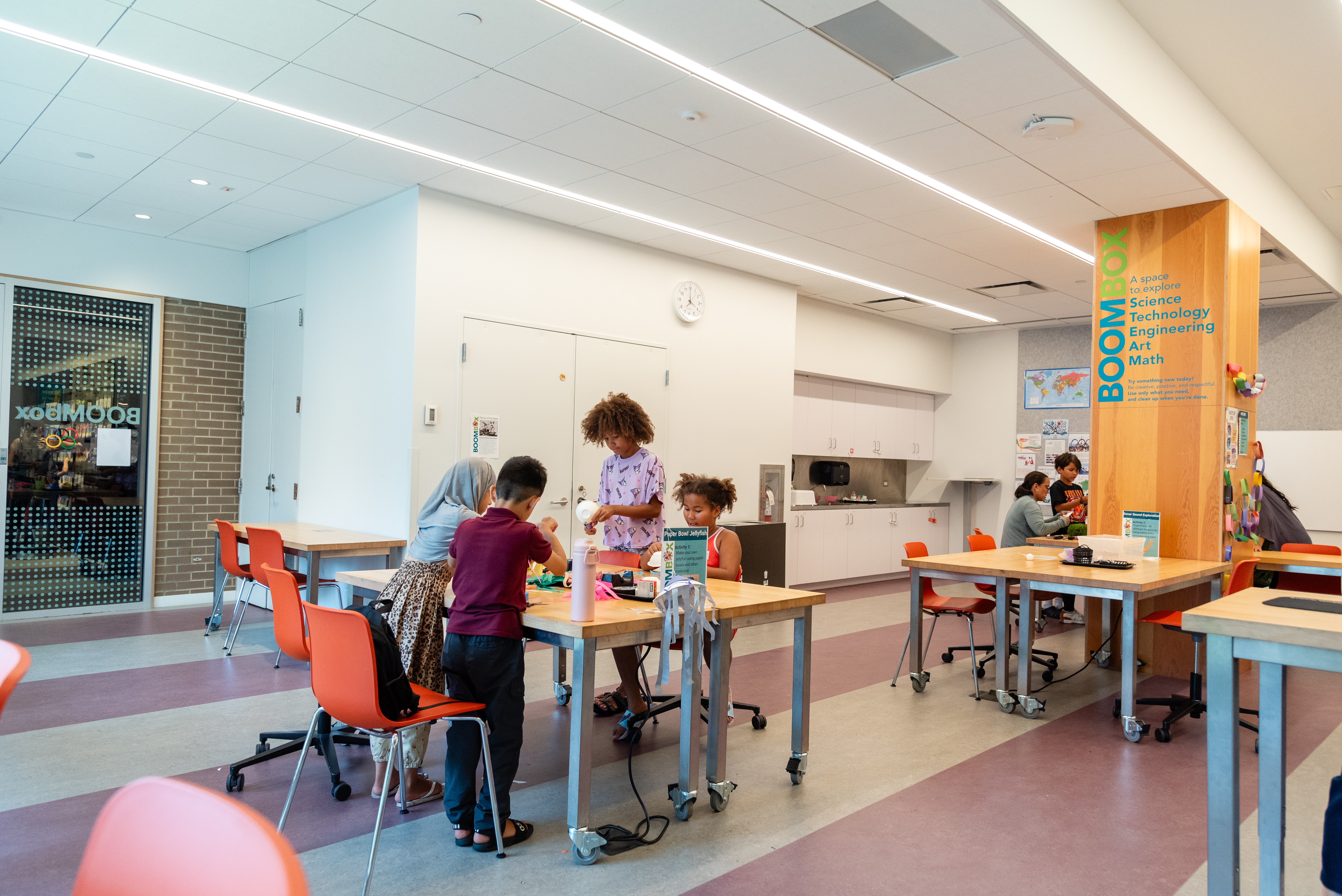 A group of children work on a science project at a table